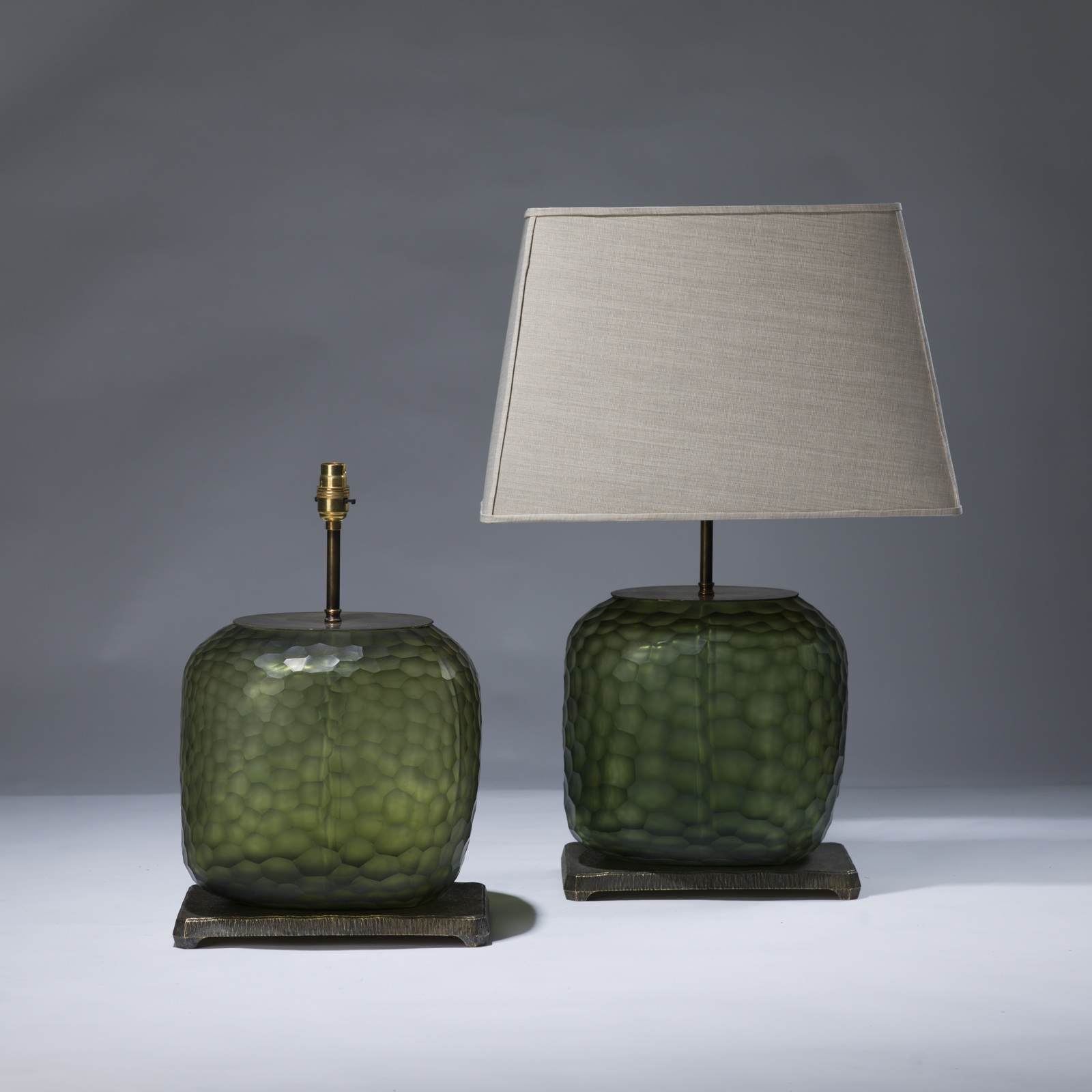 Pair of medium green cut glass lamps on distressed brass bases (T3038