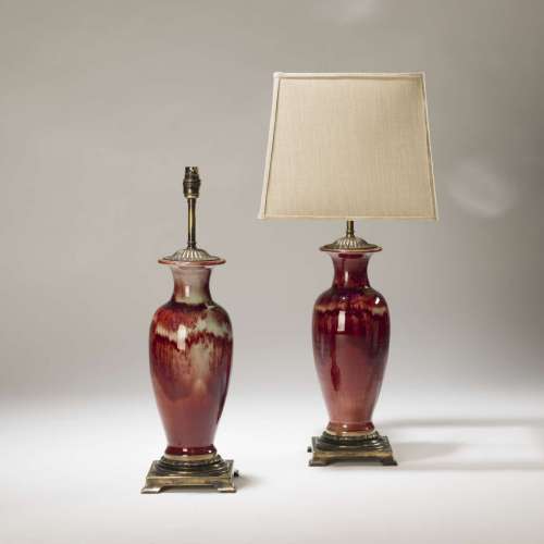 Pair Of Medium Red Faded Ceramic Lamps On Distressed Brass Bases