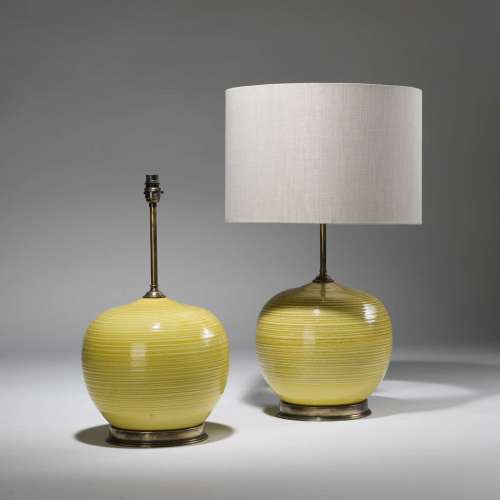 Pair Of Medium Round Yellow Ceramic Vases On Distressed Brass Bases