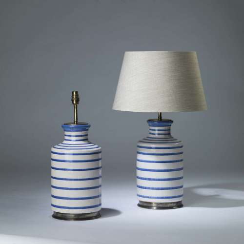 Pair Of Large White And Blue Ceramic Line Lamps On Round Brass Bases
