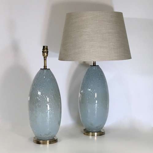 Pair Of Medium Blue Grey Glass "Almond" Lamps On Antique Brass Bases