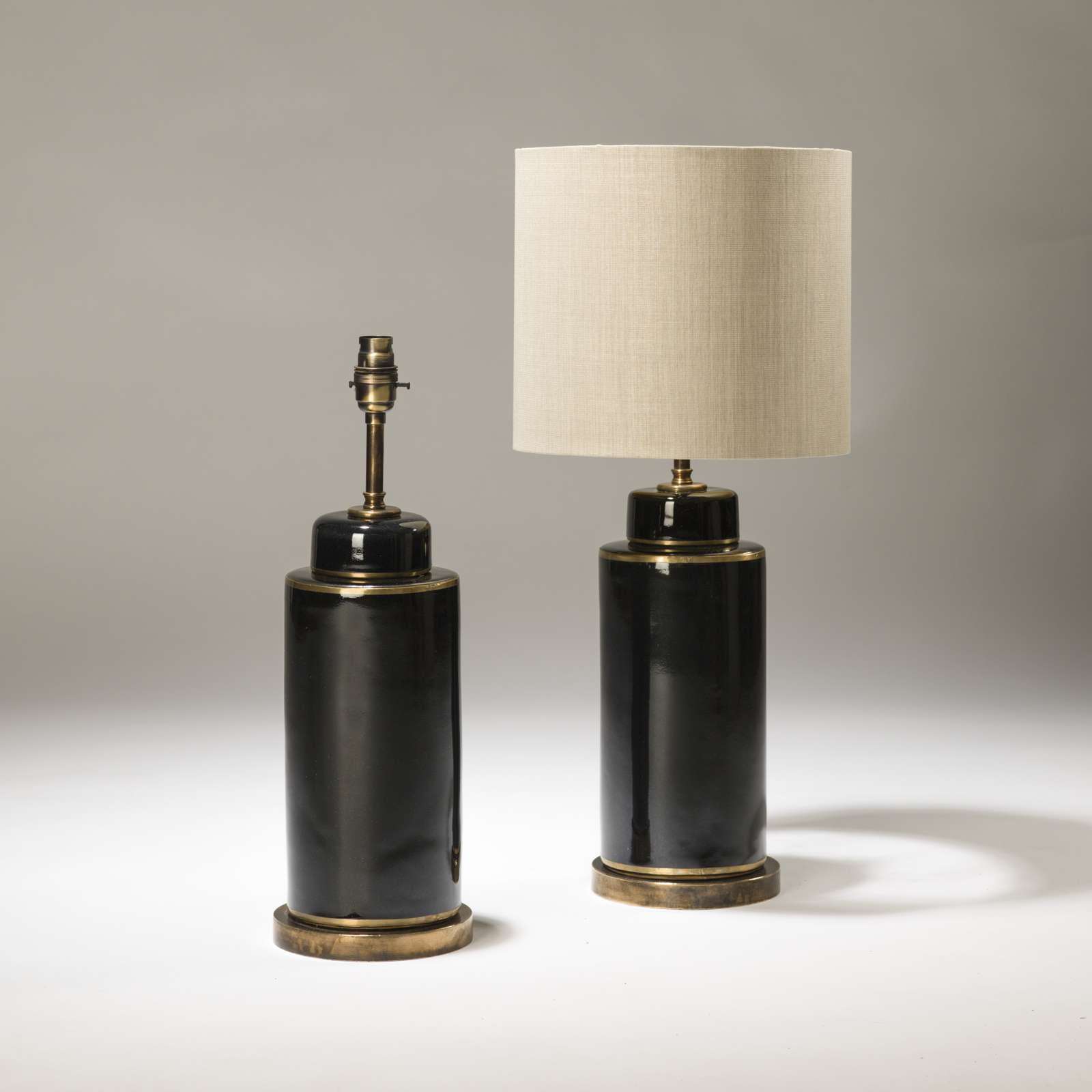 Pair Of Small Black Ceramic Pot Lamps On Distressed Brass Bases (T3723
