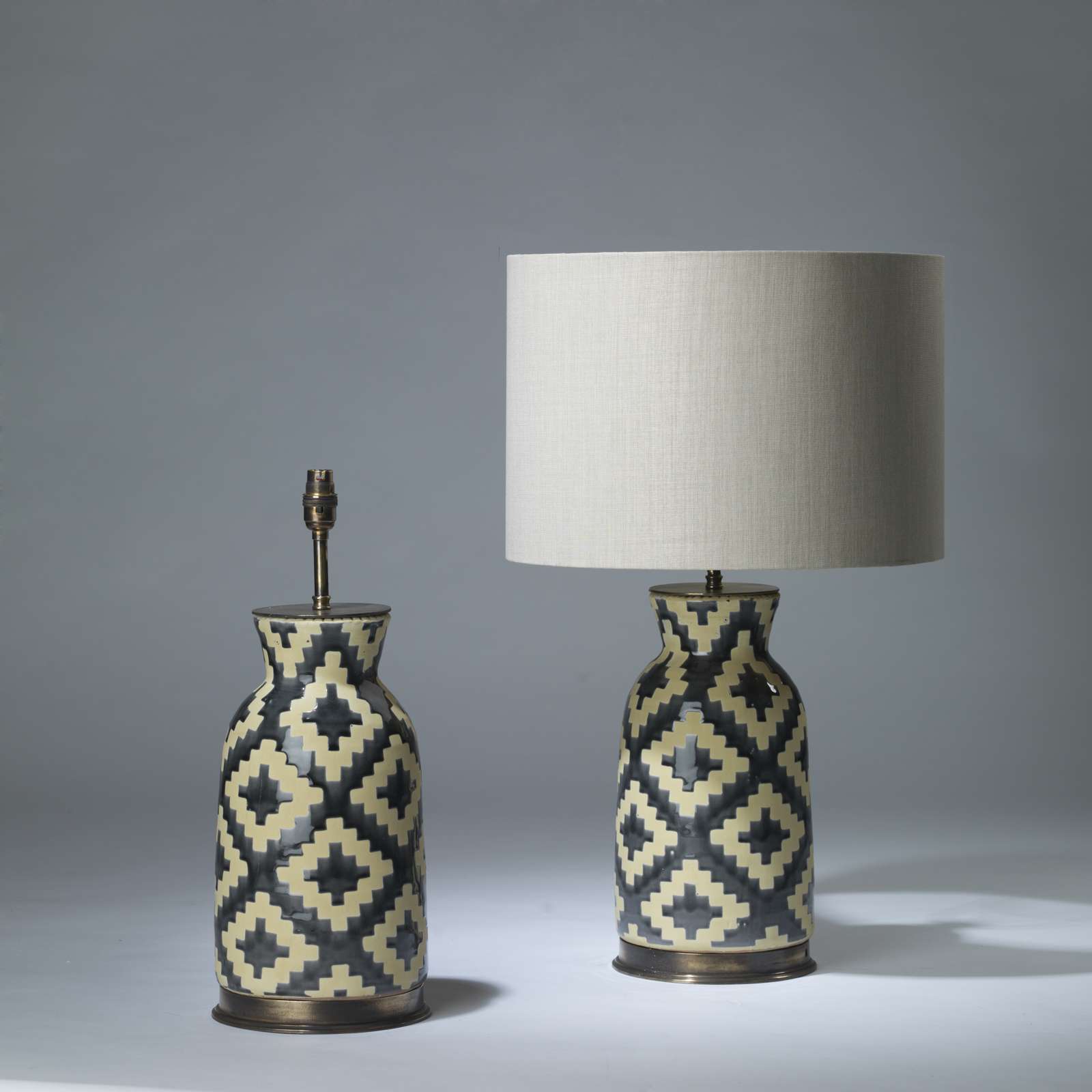 Pair Of Medium Dark Grey And Beige Ceramic Aztec Lamps On Pair Of Medium Dark Grey And Beige Ceramic Aztec Lamps On