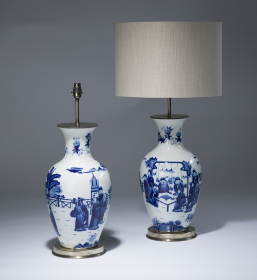 Pair Of Medium Blue & White Ceramic Lamps On Distressed Brass Bases