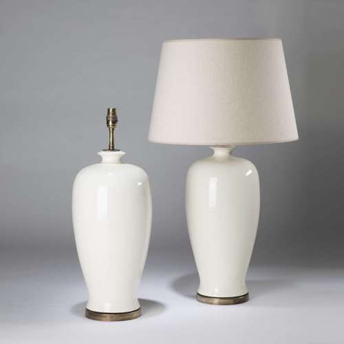 Pair Of Large Cream Ceramic Urn Lamps On Round Antiqued Brass Bases