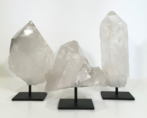 Pieces Of Polished Clear Quartz On Metal Stands