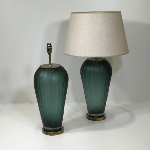 Pair Of Large Greeny  Blue  Vertically Cut Handblown Glass Lamps On Distressed Brass Bases.
