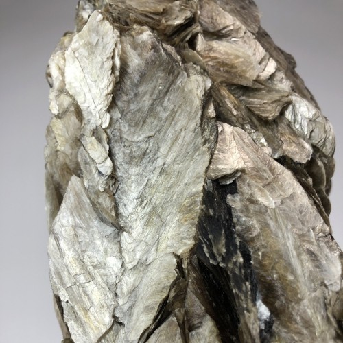 Silver Mica Mineral on Brown Bronze Stand